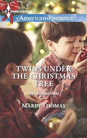 Twins under the Christmas tree cover image