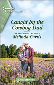 Caught by the cowboy dad cover image