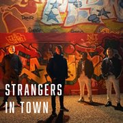 Strangers in town cover image