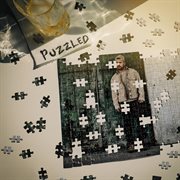 PUZZLED cover image